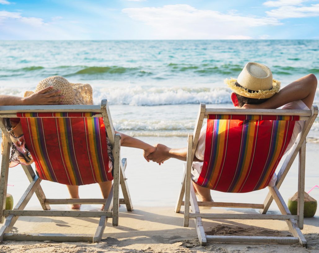relax-couple-lay-down-beach-chiar-with-sea-wave-man-woman-have-vacation-sea-nature-concept